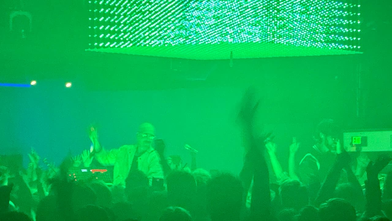 Green lighting wash across the room